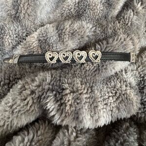 Consignment item..
Silver toned and black leather bracelet